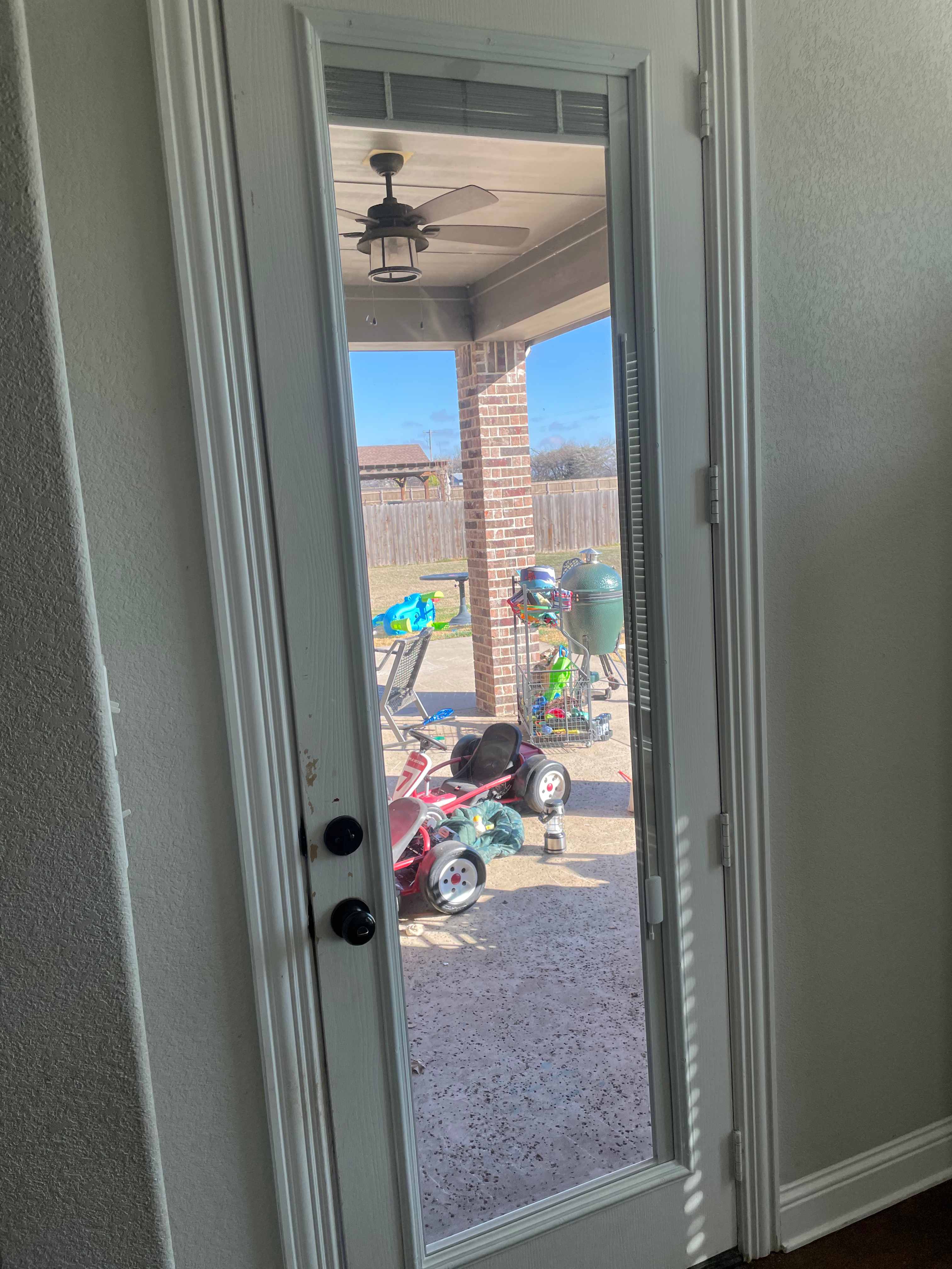 Before: Door glass replacement showing before (blinds), during (cardboard cover), and after (clear glass)